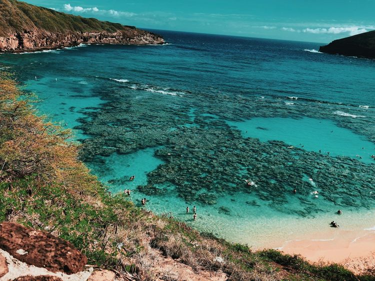 Inside an extinct volcanic crater on the southeast coast of Oahu lies Hanauma Bay, a stunning nature preserve
