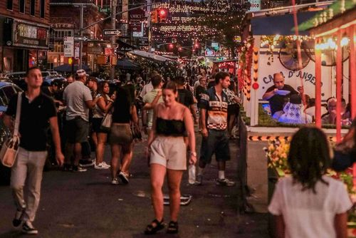 Mulberry Street is the main avenue, packed with food stalls and games.