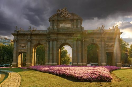 A  grand city gateway stands in the middle of Independence Square.