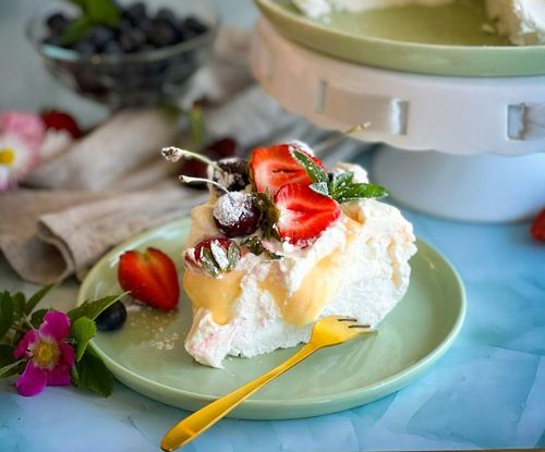 Pavlova, a meringue dessert with fruits like kiwis and berries, is also popular during the holidays.