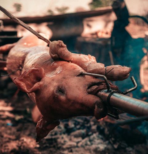 Philippine Christmas cannot miss Lechón, a whole slow-roasted pig with crispy skin